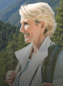 A woman enjoying the outdoors after a night of restful sleep.