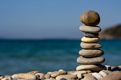 a soothing stack of rocks by the water demonstrating the calming nature of sedation dentistry