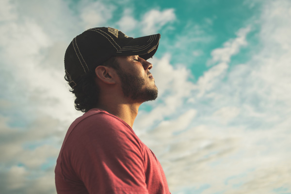 Man breathing a sigh of relief after discovering the calming affects of Sedation dentistry in Seattle, WA