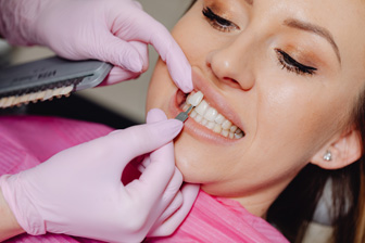 Girl being fitted for dental veneers at the dentist office in Seattle, WA