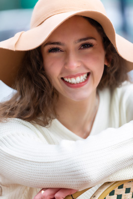 Smiling young woman with dental veneers from Seattle veneers dentist Dr. McKay